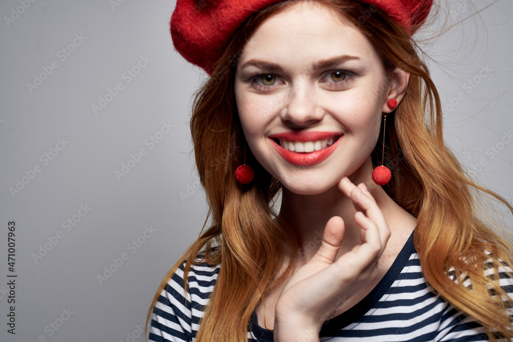 beautiful woman in a striped t-shirt red lips gesture with his hands summer beautiful woman in a striped t-shirt red lips gesture with his hands summer