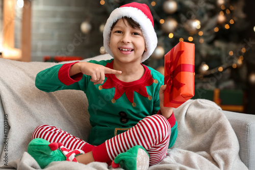 Cute little boy with gift a...