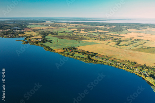 Lyepyel District, Vitebsk Region, Belarus. Aerial View Of Residential Area With Houses In Countryside. Morning Fog Above Lepel Lake And Town Skyline