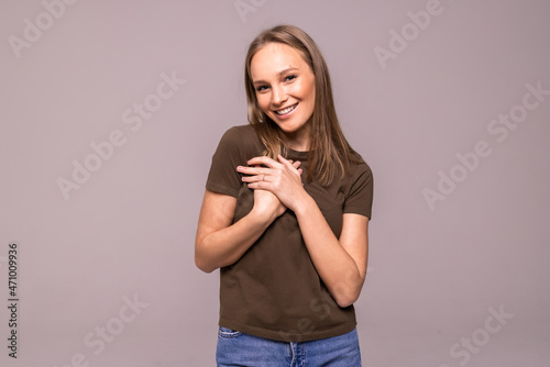 Portrait of a happy woman standing pleasend on a white background