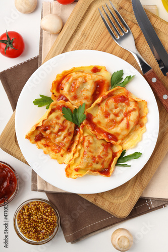 Delicious food concept with ravioli on white background