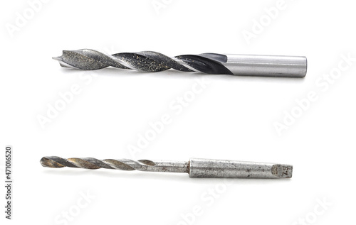 Black drill bit on white background close-up. Tool, drilling, technology, consumables, macro, sharp, black, sharpening
