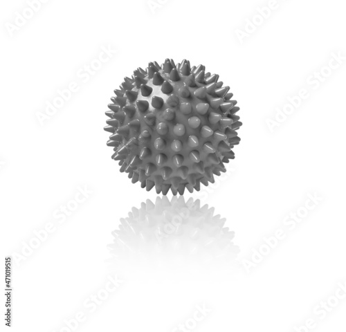 Gray plastic spiny massage ball isolated on white. Concept of physiotherapy or fitness. Closeup of a colorful rubber ball for dog teeth on a white color background. Corona virus model.