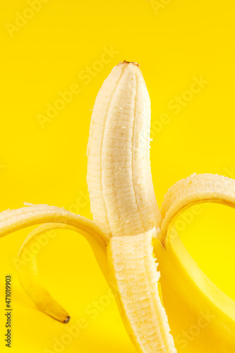 banana on a yellow background close-up shot in the studio