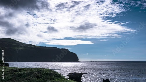 Timelapse of the cliffy coastline of the Azures Island, Portugal clouds arise