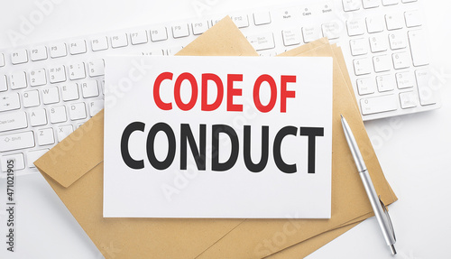 Text CODE OF CONDUCT on the envelope on the keyboard