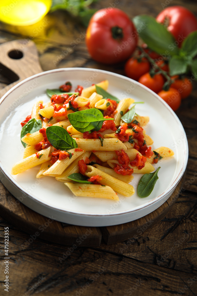 Traditional Italian pasta with tomatoes and basil Traditional Italian pasta with tomatoes and basil