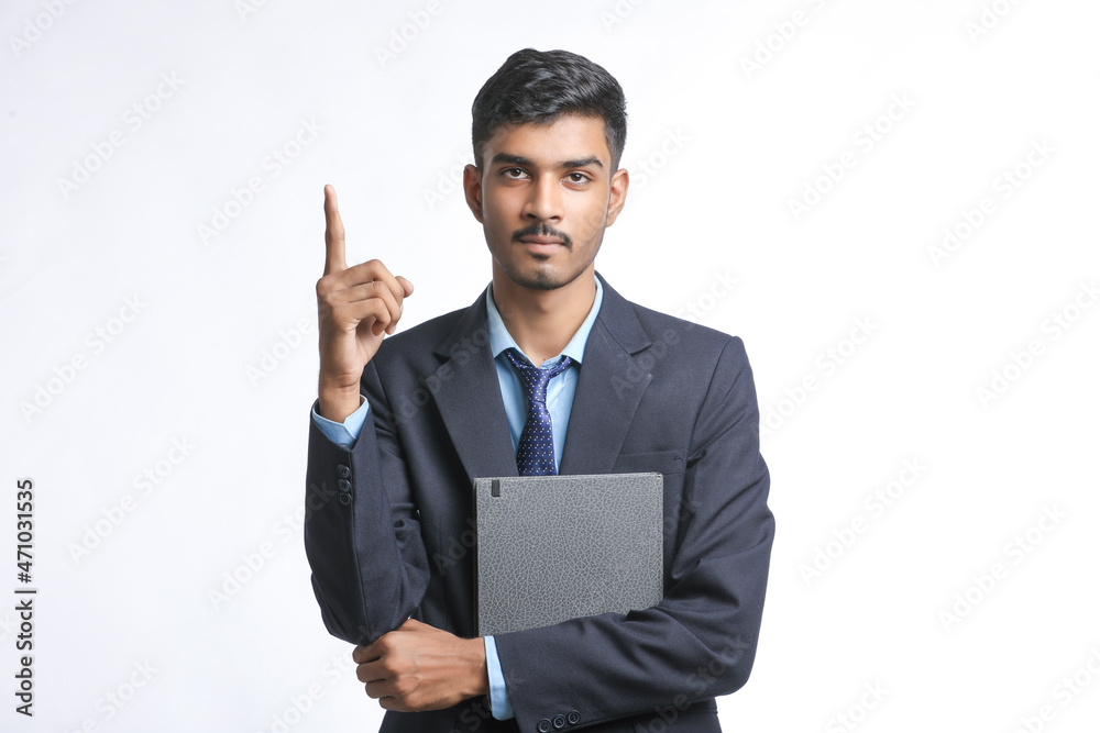 Young indian man in suit and giving expression on white background Young indian man in suit and giving expression on white background