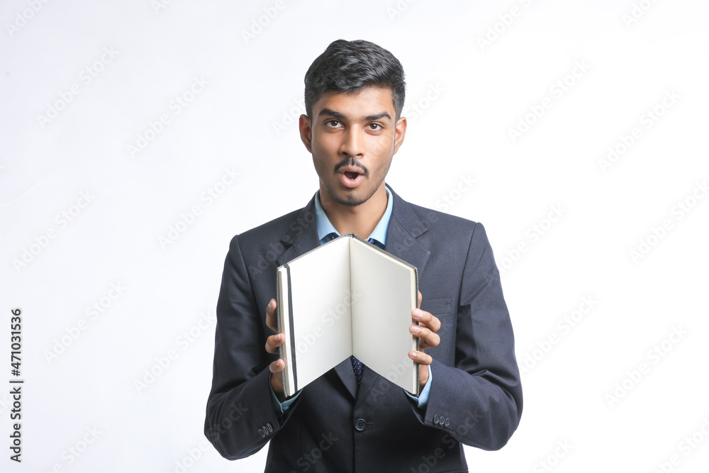 Young indian man in suit and giving expression on white background Young indian man in suit and giving expression on white background