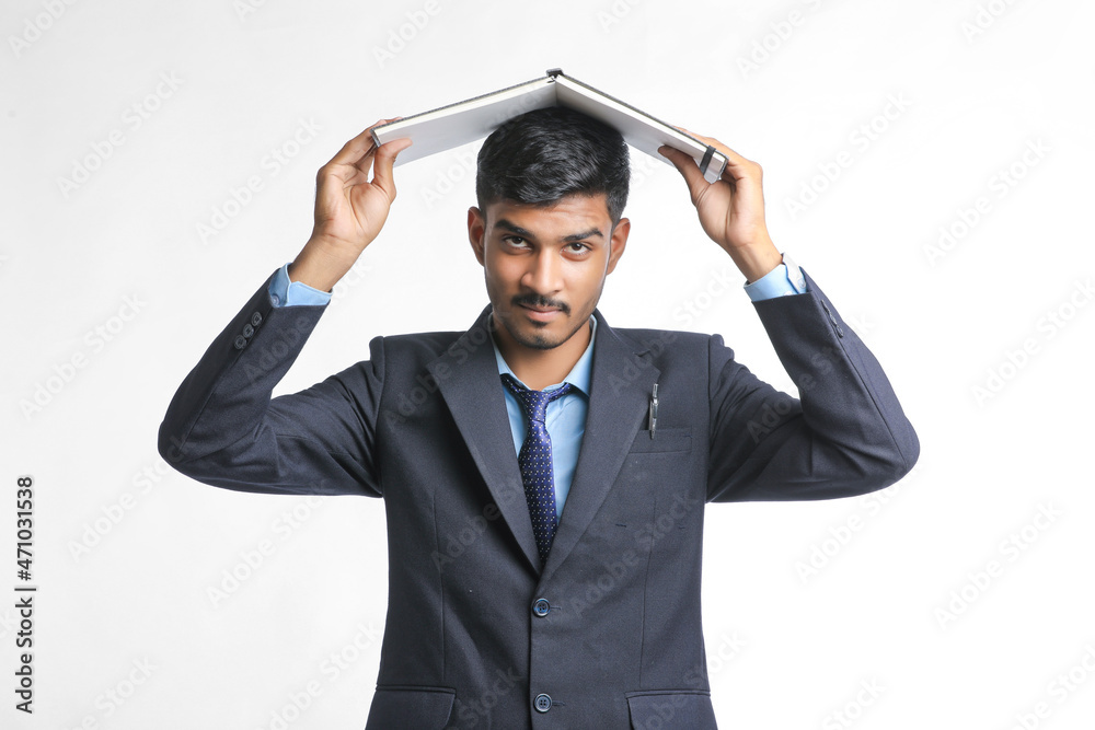 Young indian man in suit and giving expression on white background Young indian man in suit and giving expression on white background