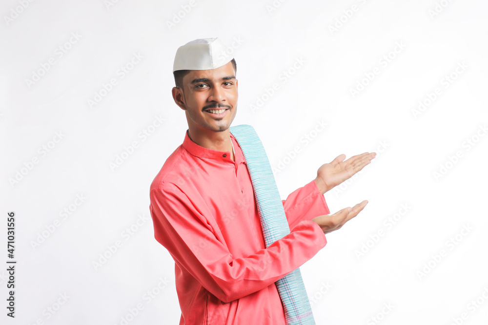 young indian man in traditional wear and showing expression on white background young indian man in traditional wear and showing expression on white background