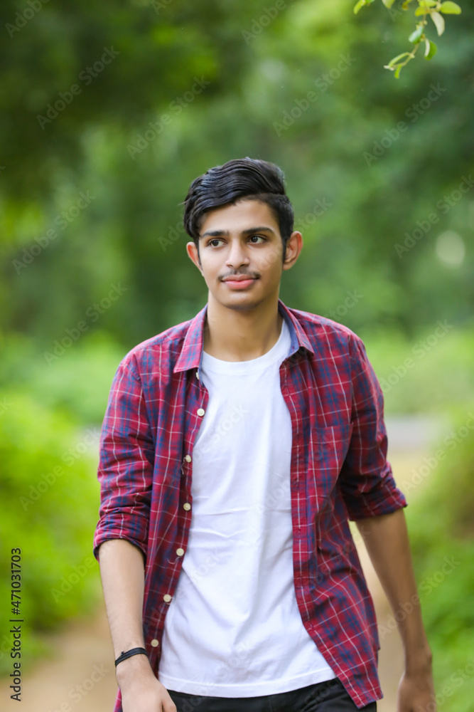 Young indian college student showing expression.
