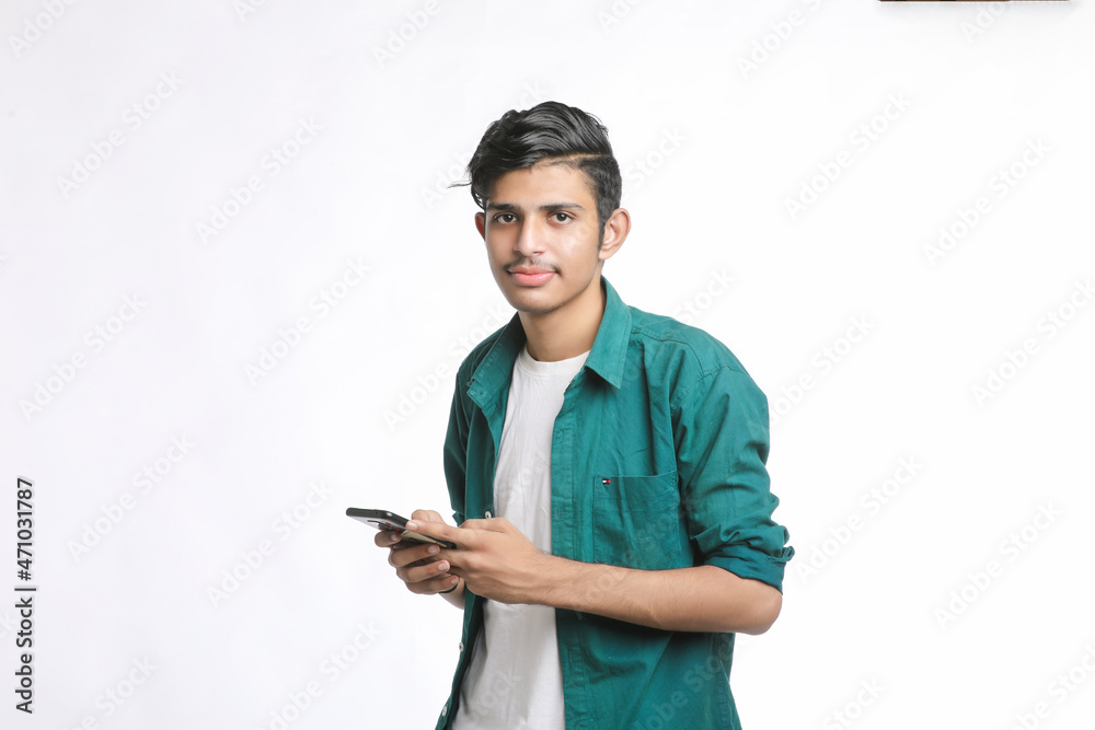 young man using smartphone on white background. young man using smartphone on white background.