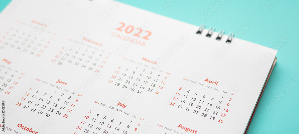 2022 calendar page on blue background business planning appointment meeting concept 2022 calendar page on blue background business planning appointment meeting concept