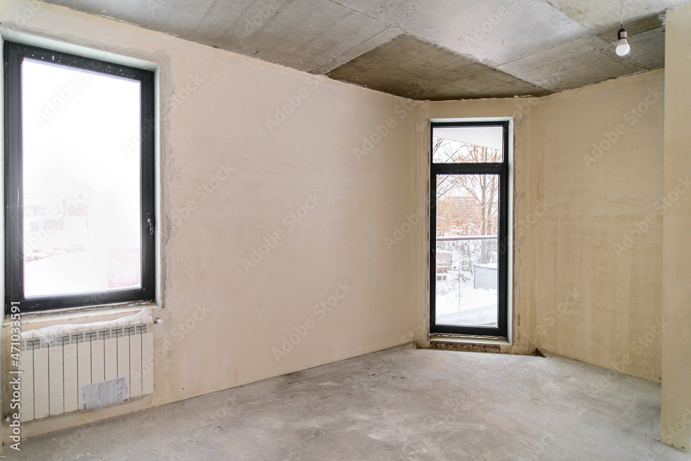 Empty room under construction in a new constructed building Empty room under construction in a new constructed building
