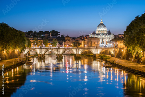 Rome skyline at night with view of St. Peter's Basilica and Tiber River 