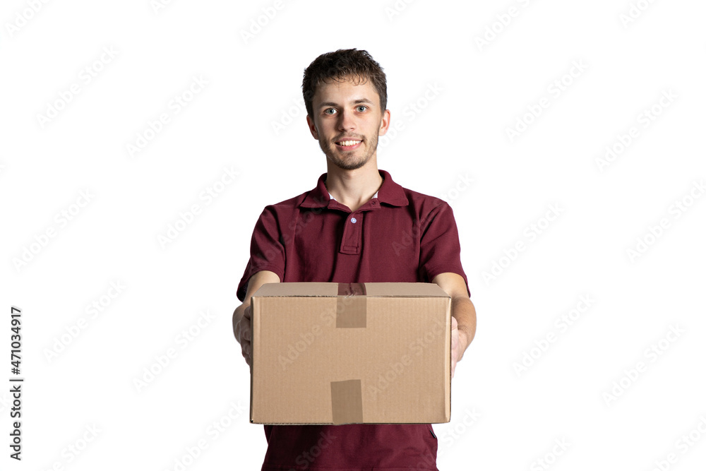 Smiling delivery man holding pile of cardboard boxes on a white background . Smiling delivery man holding pile of cardboard boxes on a white background .