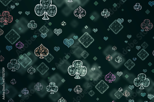 Pattern of poker playing cards on a dark background.