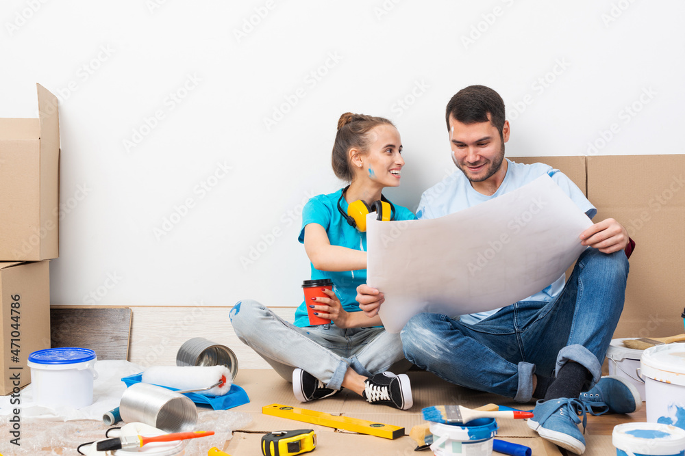 Young man and woman planning home renovation