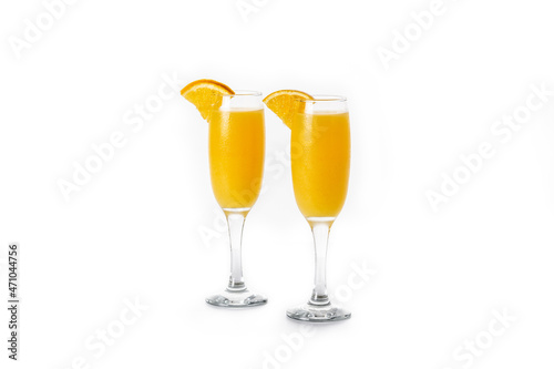 Orange mimosa cocktail isolated on white background