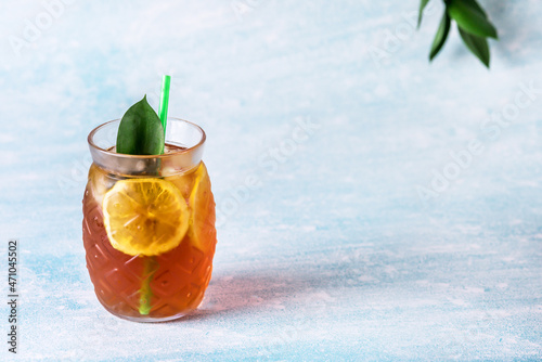 Glass of Iced Tea with Lemon Slices Blue Background Horizontal Refreshing Healthy Summer Drink Copy Space