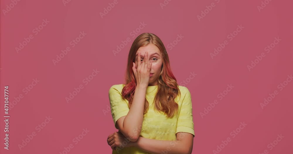 Facepalm gesture. Upset young girl slapping hand on face expressing shame about loss, failure, shaking head Facepalm gesture. Upset young girl slapping hand on face expressing shame about loss, failure, shaking head
