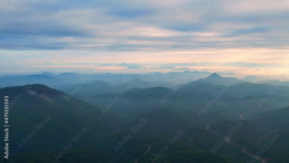 4K Flying through the clouds above mountain tops. Tropical forest with smoke and fog.
4K Flying through the clouds above mountain tops. Tropical forest with smoke and fog.