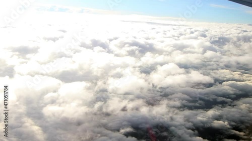 Clouds footage aerial view. Clouds taken from an international flight on the move. Fluffy clouds photo