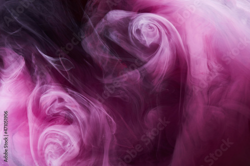 Pink smoke on black ink background, colorful fog, abstract swirling touch ocean sea, acrylic paint pigment underwater