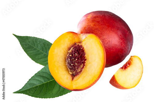 Fresh cut nectarine with slice and leaves isolated on white background.