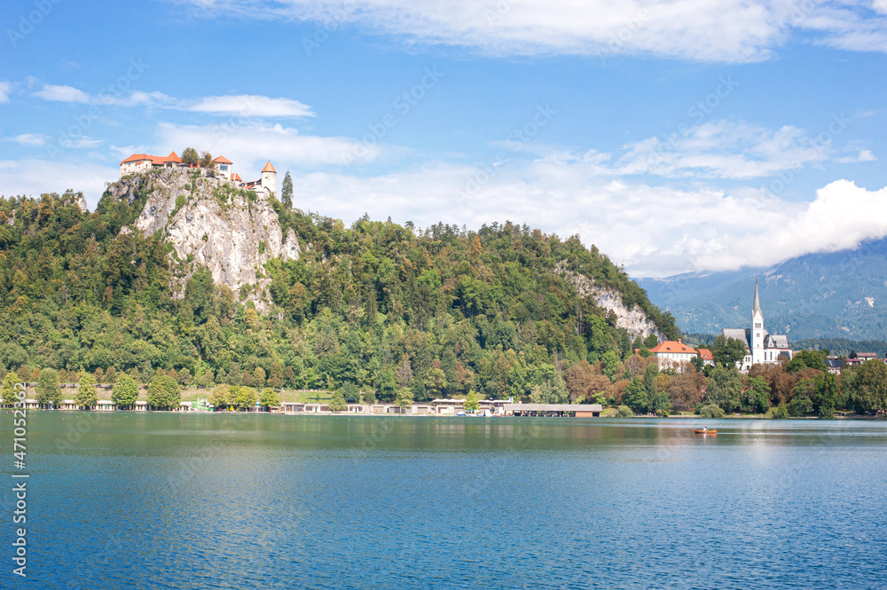 castle in the middle of a clean mountainous emerald lake Bled against the backdrop of the Slovenian Alps