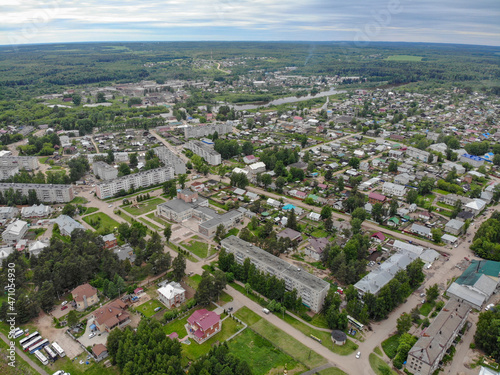 Aerial view of the village in summer in cloudy weather (Murygino, Kirov region, Russia) © vladok37