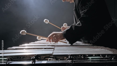 Man musician playing metallophone photo