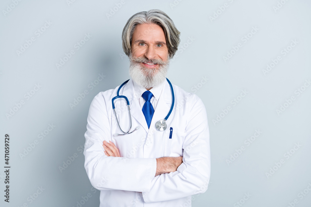 Photo of pretty cheerful senior man doc dressed white uniform smiling hands crossed isolated grey color background Photo of pretty cheerful senior man doc dressed white uniform smiling hands crossed isolated grey color background