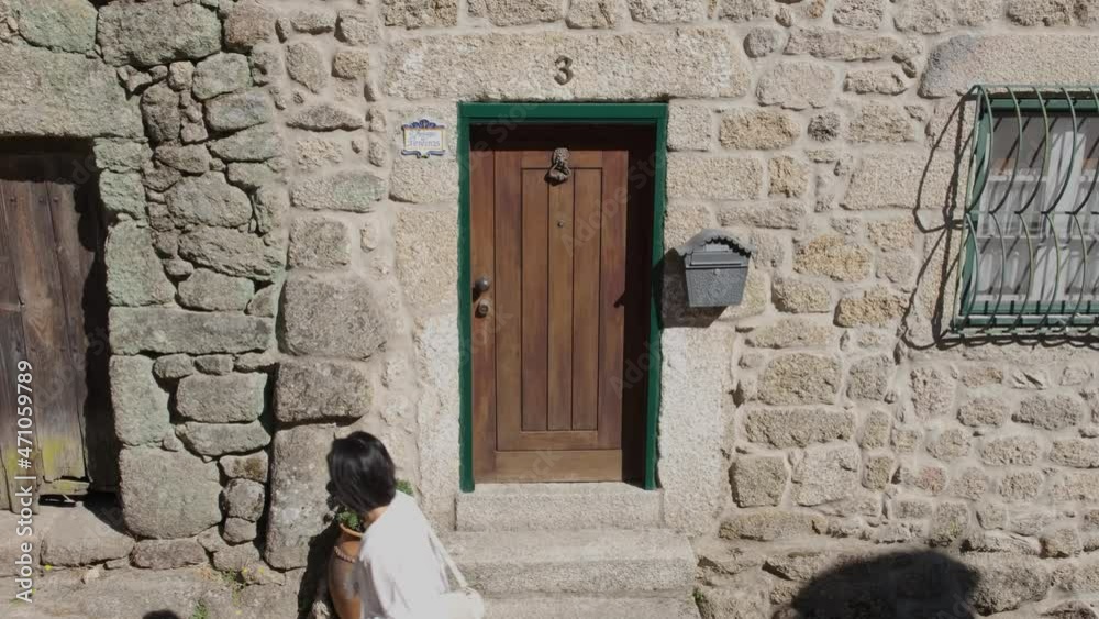 Wooden door on stone house facade in old Portuguese village, Monsanto. Static view Wooden door on stone house facade in old Portuguese village, Monsanto. Static view