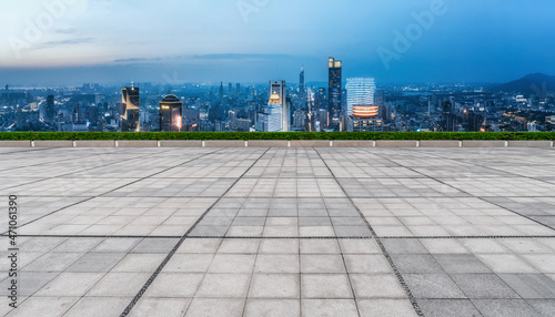 Empty brick floor with city skyline background © 昊 周