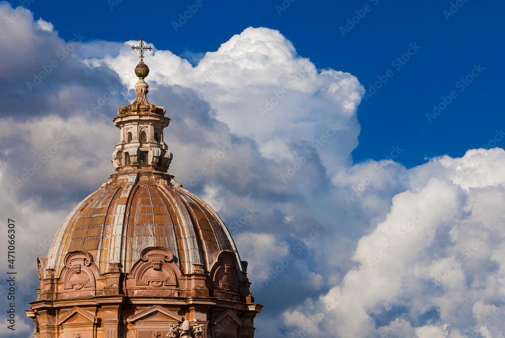 Baroque art in Rome. Saints Luca and Martina beautiful baroque dome and lantern, built in the 17th century, among clouds as artistic background