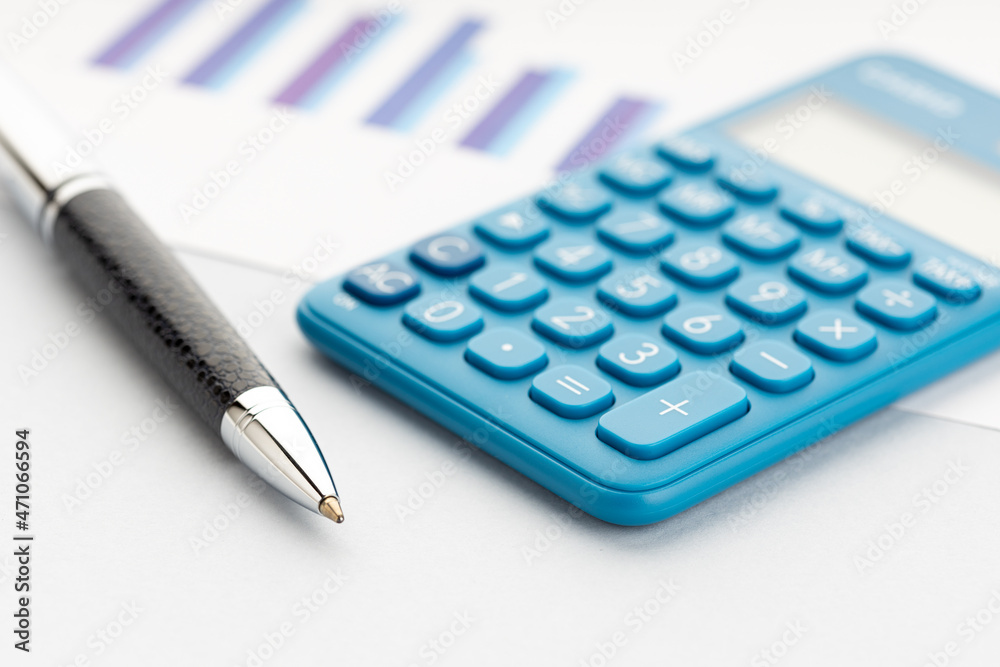 Business planning concept background. Calculator, pen and chart on table Business planning concept background. Calculator, pen and chart on table
