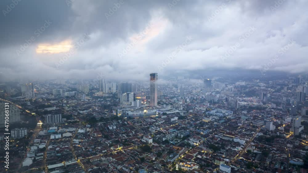Time lapse of rolling clouds over city of Penang (Pulau Pinang) Malaysia during sunset dusk. 