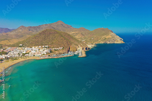 Aerial view of the coastline of the town of San José with the harbour and the mountains in the background in the Province of Almería, Andalusia, Spain. photo