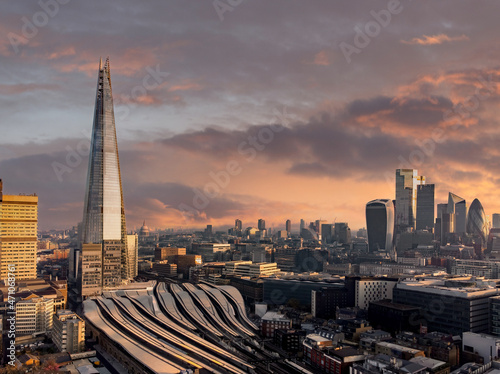London, the shard and London Bridge train station, aerial skyline view of the city at sunrise looking over London Bridge Railway station, the Shard and London financial district landmarks