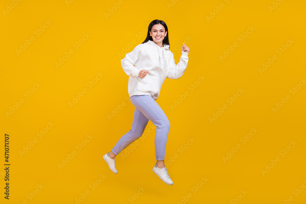 Full body profile side photo of lady jump run fall season discounts shopping concept isolated over bright yellow color background