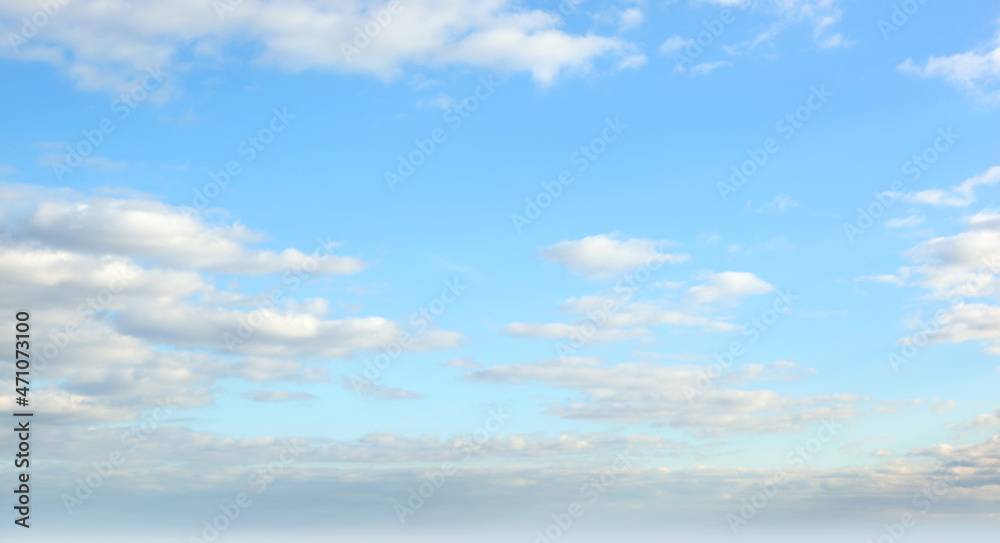 Blue sky with puffy clouds