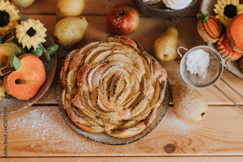 homemade cakes, sweets and fruits are on the wooden kitchen table. waffles, marshmallows, marmalade, cookies, gingerbread, apple pie. High quality photo