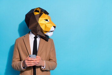 Profile side photo of freak guy in lion mask use smart phone text social-network discount look empty space isolated blue color background