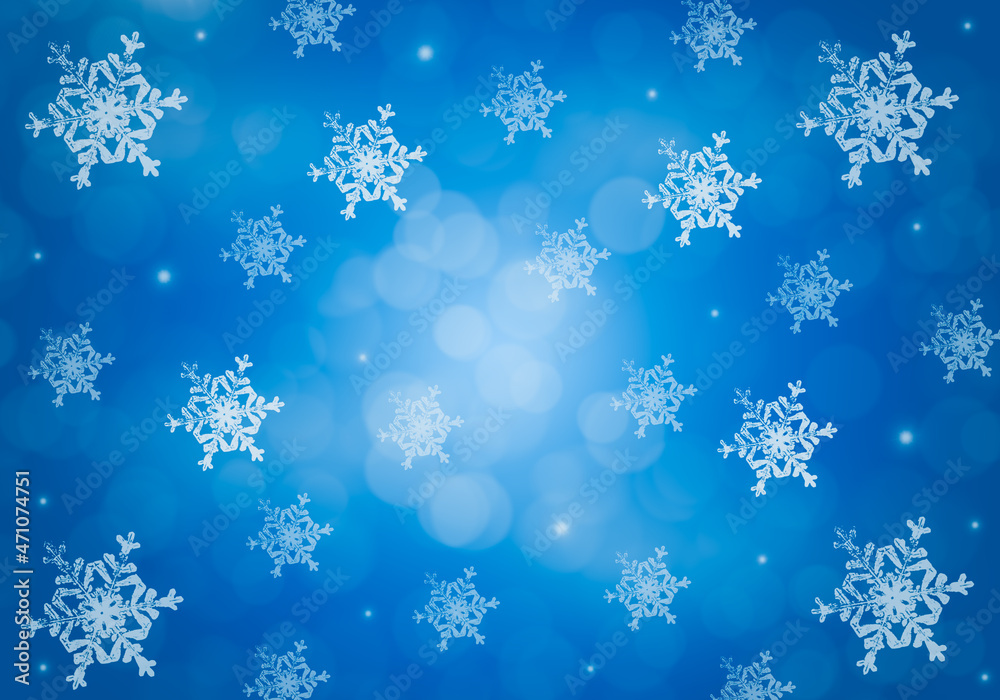 Blue winter background with snowflakes.