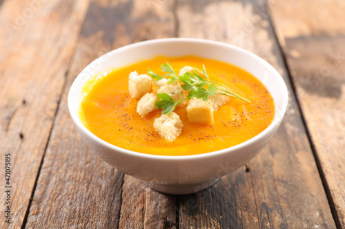 bowl of pumpkin soup and crouton