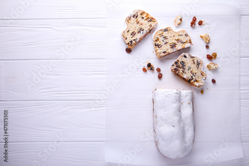 Dresdner Stollen is a Traditional German Cake with raisins on white background with place for text. Fruit cake for the Holiday.