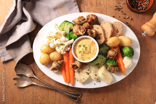 platter of aioli, fish and vegetables photo