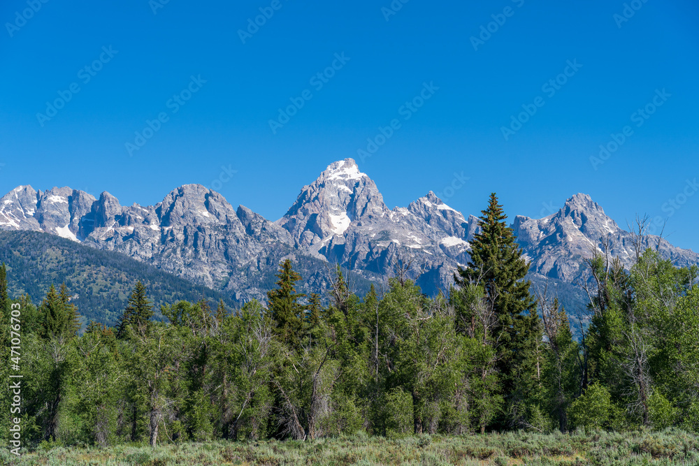 Obraz premium The rocky peaks of the Grand Teton mountain range near Jackson Hole, Wyoming
